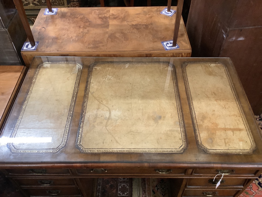 A Georgian style walnut desk with triple skiver, width 123cm depth 72cm height 74cm